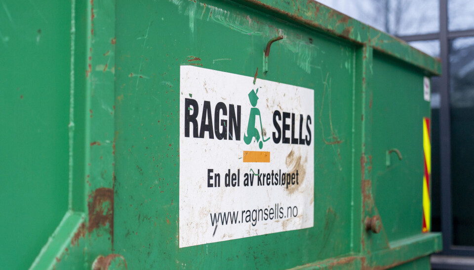 Green Ragn-Sells container with logo and website on the side.