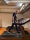 Ole Einar Brækken runs on a treadmill in an indoor test room with exposed ductwork.