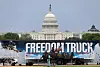 Freedom Truck mobile museum parked in front of the US Capitol with freedom-themed graphics.