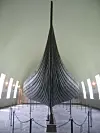 Front view of the Gokstad Viking ship displayed indoors at Oslo’s Viking Ship Museum.