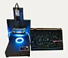 Screen showing plankton and a lice larva next to a glowing laboratory analysis device.