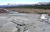 Bare landscape with mountains in the background.
