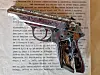 A small metal pistol rests on top of a printed page of old paper.