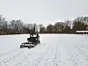 Ground-penetrating radar equipment surveys a snowy sports field in Byparken, Roskilde.
