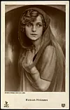 Sepia studio portrait of Aud Egede-Nissen on a vintage Berlin film-star postcard.