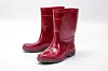 Glossy red short rain boots standing side by side on a white background.