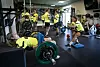 BK Häcken women’s team members complete strength exercises in a gym, with a player lifting a barbell in the foreground.