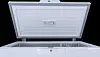 Close up of a large freezer with an open lid