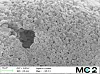 Close-up of the texture of a micrometeorite.