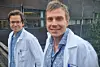 Asbjørn Christophersen and Andreas Lossius in white laboratory coats outside a university building.