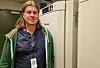 Anders Aak standing in front of technical cabinets in the laboratory.