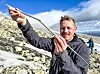 Kjetil Loftsgarden holds a complete arrow approximately one metre long.