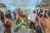 A resident holds a placard reading ''MONUSCO get out without delay'' as they protest against the United Nations peacekeeping force (MONUSCO) deployed in the Democratic Republic of the Congo, in Goma, Monday, July 25, 2022. Demonstrators said they were protesting against the rise of insecurity and inaction of the UN in the region. (AP Photo/Moses Sawasawa)