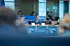 Panel discussion at an AFET presentation, with speakers seated behind European Parliament-branded desks.
