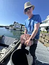 Man holding a large stone